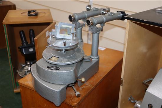 A Comparison microscope unit, no.128, cased, a Spencer Buffalo USA microscope microscope, no.148608, cased and